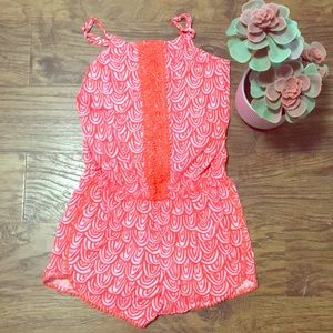 A pink and orange romper.